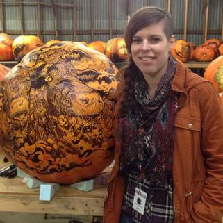 Amie Villiger Harris next to Revenge of the Farm Animals pumpkin